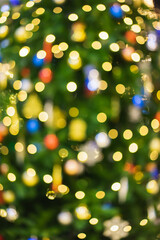 Obraz na płótnie Canvas Christmas tree in colorful lights, Christmas bokeh concept.