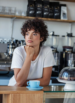 Portrait of beautiful young woman in a cafe