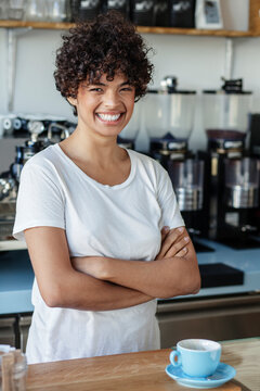 Portrait of beautiful young cofee shop owner