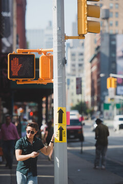 Attractive young man standing in the street in New York City