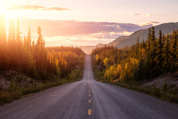 Scenic Road View of Klondike Hwy during a sunny and colorful sunset. Taken North of Whitehorse,...
