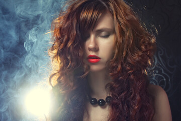 Fototapeta premium young and sexy woman in smoke