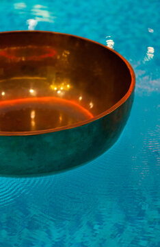 Resonating Tibetan bowl of water