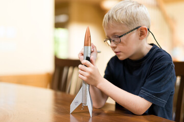 Little Boy Rocket Scientist WIth Home Made Model Rocket Ready for Flight
