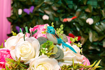 Table with children's birthday party decoration with objects and colorful candies