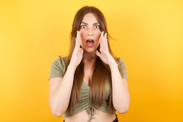 Studio shot of scared terrified Caucasian  isolated over white background. customer shocked with prices at shop, being short of money to buy something, People and human emotions concept