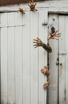 Zombies breaking out of a door