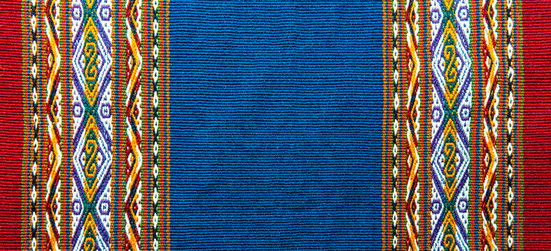 Traditional design of sheep and alpaca wool textile in the local art and craft market of Cusco, Peru.