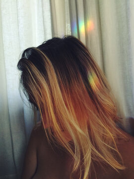A woman with a rainbow on her