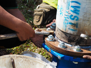 Bolt and nuts installation work on main pipe connections