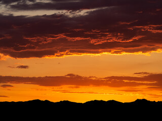 Pano of sunset over the silhouetted Rocky Mountains near Denver, Colorado