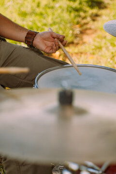 Drummer playing in nature