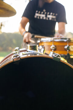 Drummer playing in nature