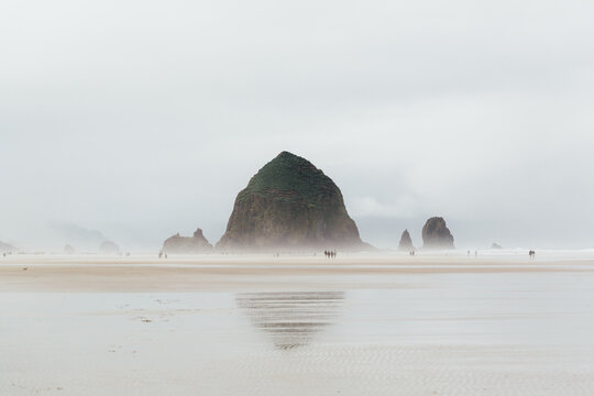 Haystack Rock and misty sea in Cannon Beach