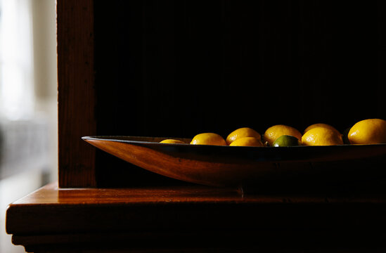 Bowl of Lemons and Limes in the Pantry on countertop