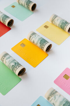 Concept for finance : dollar rolls and colorful credit cards