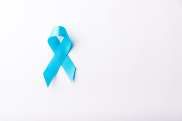 November light blue ribbon, studio shot isolated on white background, Prostate cancer awareness month, men's health concept