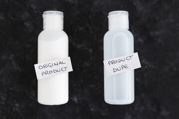 imitations and unfair competition, couple of body lotion bottles with Original vs Dupe product labels