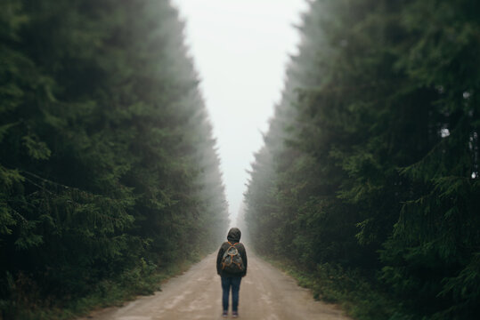 Person standing on a road