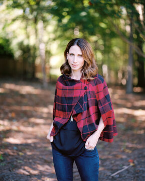 Beautiful and fashionable woman in a poncho