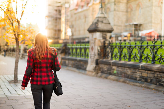 Canadian Business Woman Walking On Wellington Street In Front of Parliament Hill Ottawa Canada