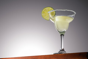 Margarita Cocktail on a Wooden Surface With Gradient Background