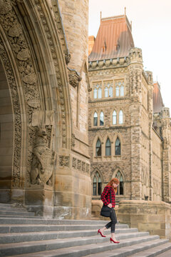 Woman Public Service Worker Leaving Work at Parliament Hill Ottawa Canada under Peace Tower