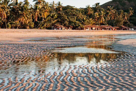 Rest of a rising tide on a sandy tropical beach