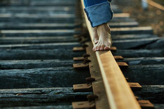 Feet on the train tracks