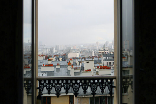 Out A Window At The Rooftops Of Paris France On A Cloudy Day