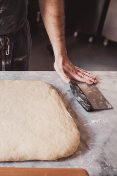 Artisan preparing doughnut dough