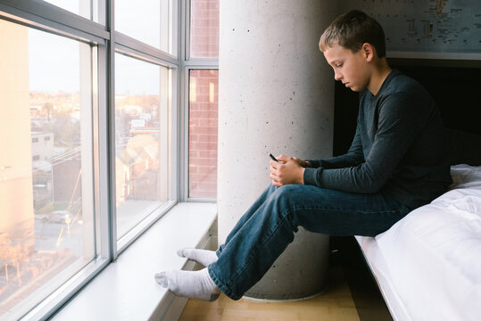 Eleven-Year-Old Boy Using Cellphone