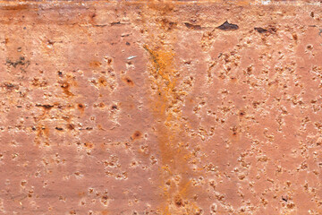 Steel wall sprayed red rust spots. Iron surface rust.