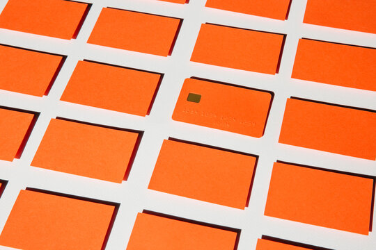 One orange blank credit card in a rectangle shaped background