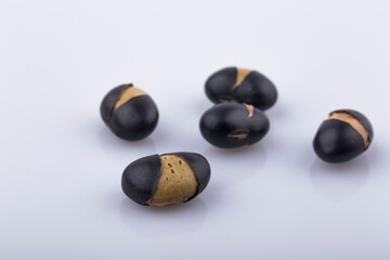 Close up black beans isolated on white background.