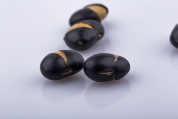Close up black beans isolated on white background.