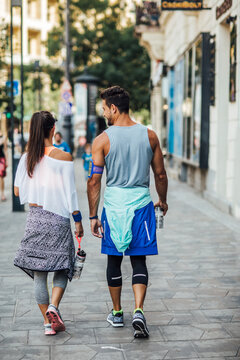 Couple in Sportswear Walking on the Street