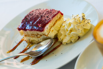 Image of piece of blueberry cake served with whipped cream