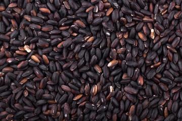 Close up background view of organic black purple rice.