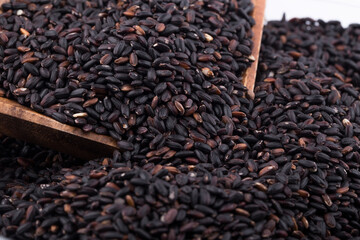 Close up background view of organic black purple rice.