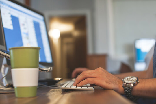 Working from home on laptop computer.