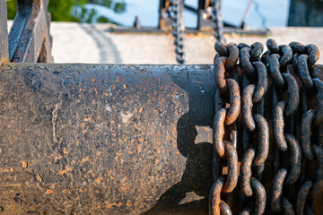 Rusting metal chains on iron spool