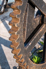 Large iron gear cog with rusting edges