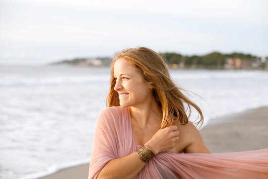 Woman looking out at ocean