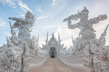 Outside photo of Wat Rong Khun Commonly known as the White Temple, a cultural attraction Famous and attention of tourists In Chiang Rai, Thailand