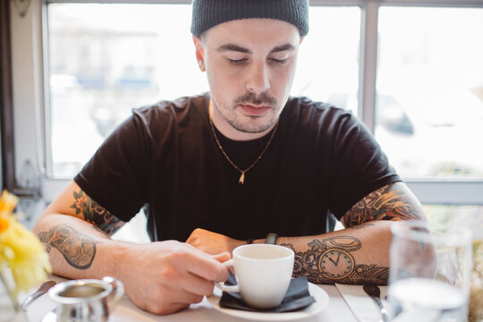 Portrait of young man in urban restaurant