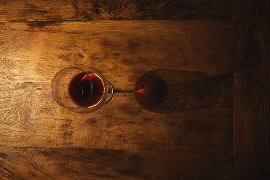 Red wine glass with prism reflection
