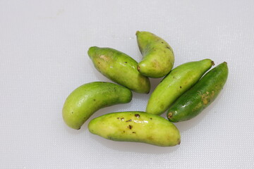 Organic Raw green Coccinia grandis or Ivy gourd on a white background