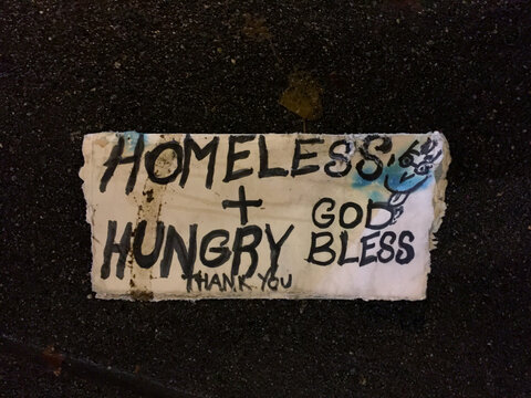 Homeless and Hungry Sign On The Ground