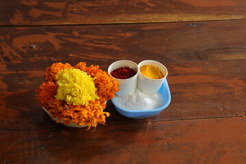 Marigold flowers on wood background